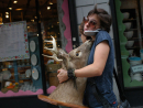 girl-carrying-deer-head-NY.jpg