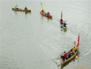 The flotilla approaches the waiting crowd at the South Branch House Historic Sit