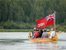 Voyageur canoe heading away from this Hudson's Bay Company outpost